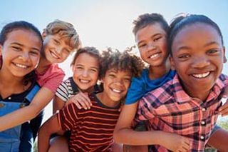 Group Of Childer Smiling Together — Child Dentist In Mcallen, TX