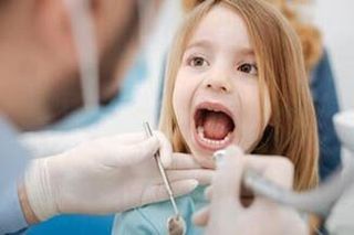 Little Girl Having A Dental Check Up — Child Dentist In Mcallen, TX