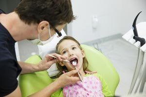 Child Having Dental Treatment — Child Dental Care In Mcallen, TX