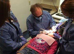 Dr. Bill Pope Performing A Dental Treatment To A Patient — Child Dental Care In Mcallen, TX