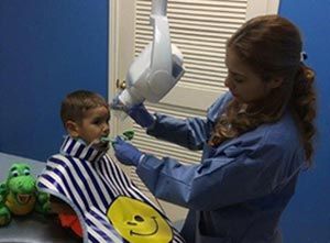 A Little Boy Having Dental treatment — Child Dental Care In Mcallen, TX