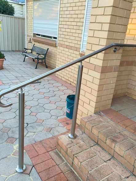 A bathroom under construction with tiles on the floor and a window.