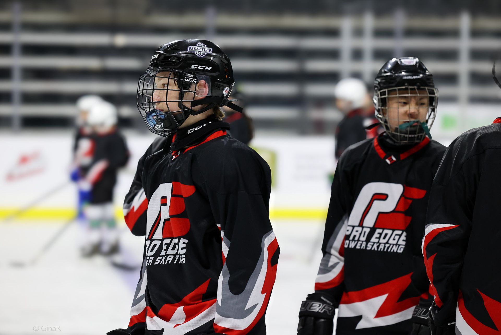 A group of hockey players are standing on the ice.