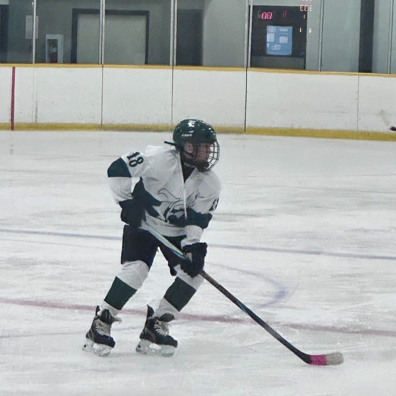 A hockey player with the number 18 on his jersey