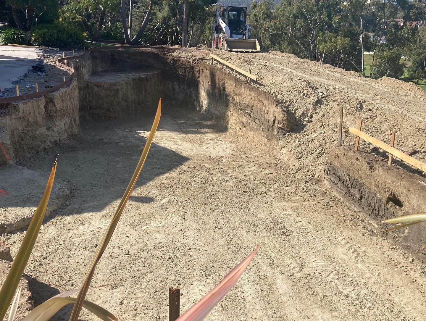 A construction site with a bulldozer in the background