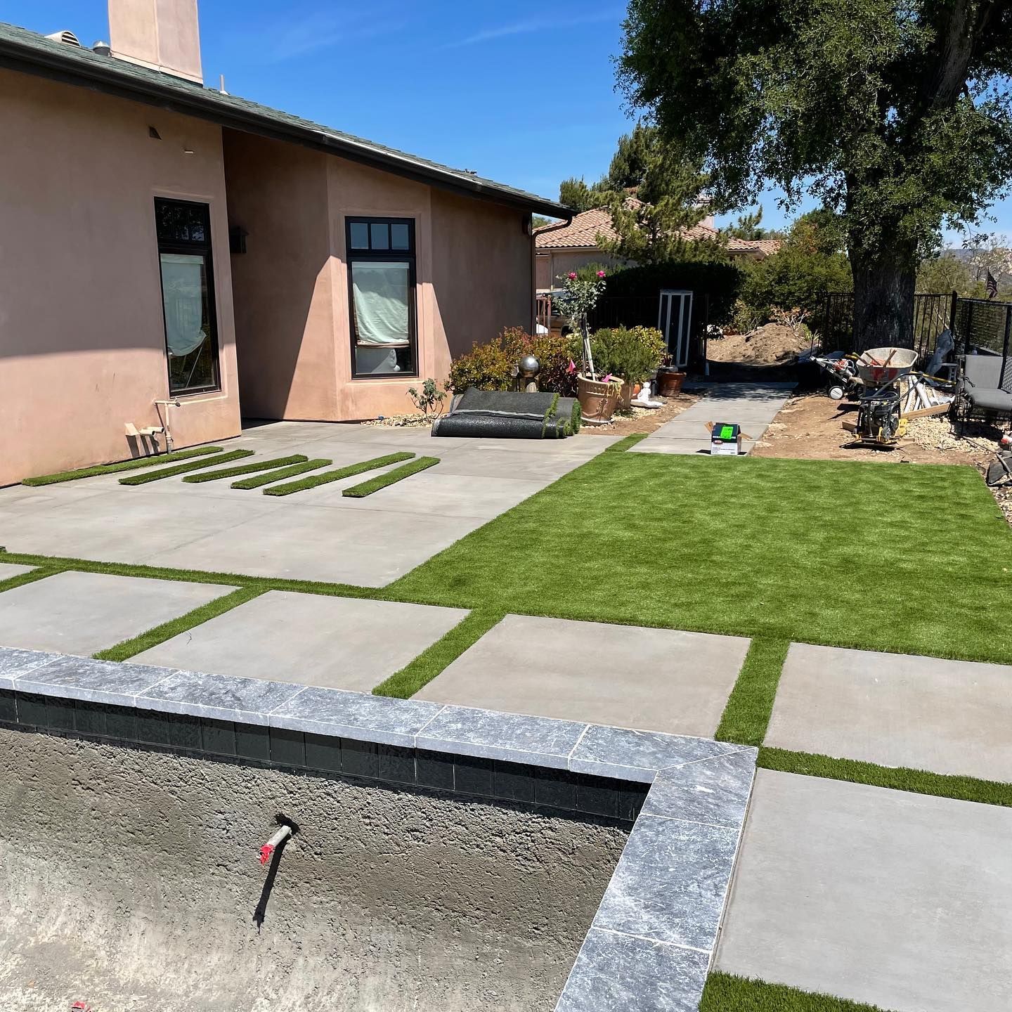 A house with a large lawn in front of it