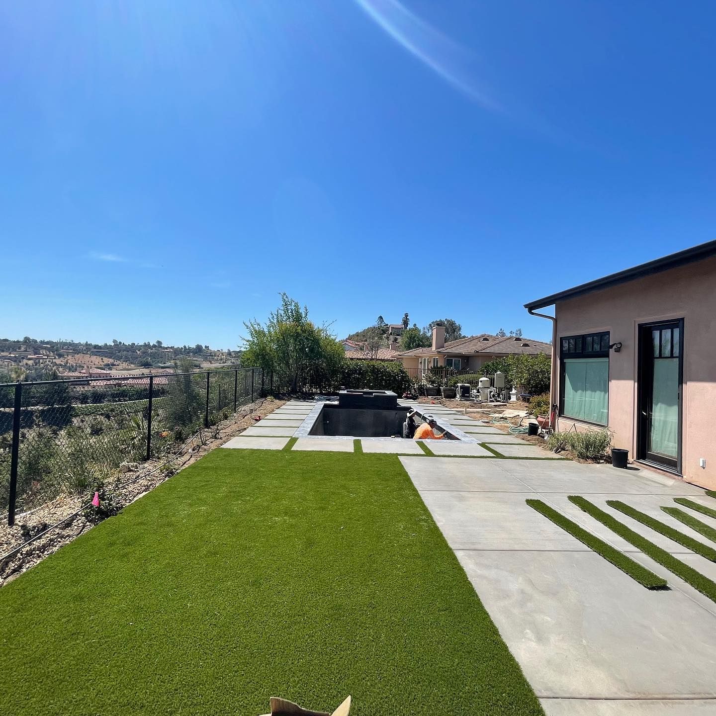 A house with a swimming pool in the backyard