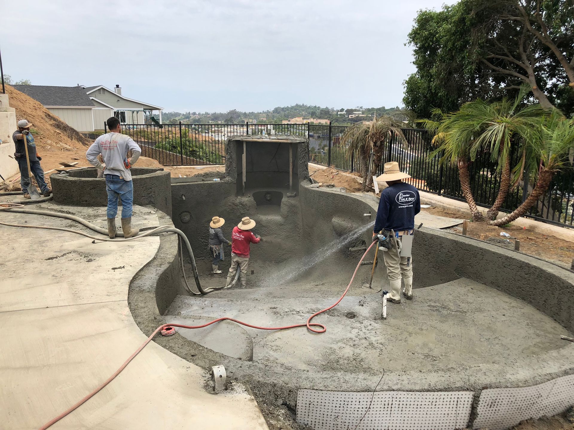 A group of people are working on a swimming pool.