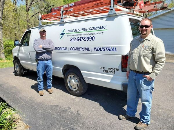 Standing beside the company van — Evansville, IN — Sims Electrical, Plumbing, & Mechanical