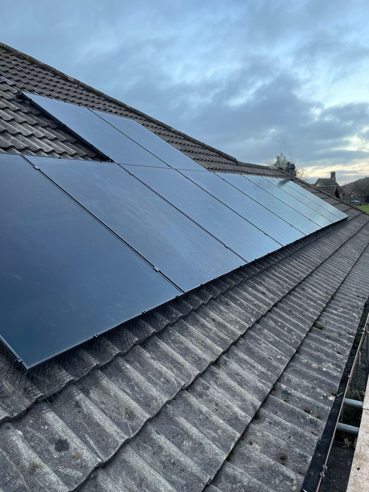 Black solar Panels on a tiled roof
