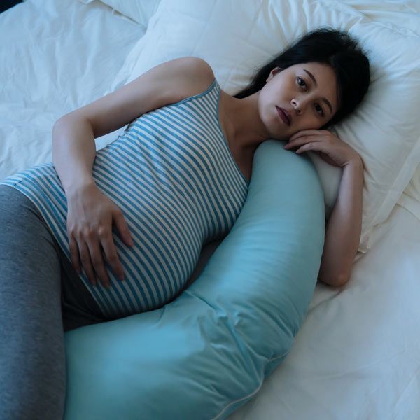 pregnant woman with Progesterone Deficiency is up with insomnia, worried about her pregnancy