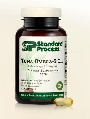 Bottle of Standard Process Tuna Omega-3 Oil dietary supplement, with two softgels in front.