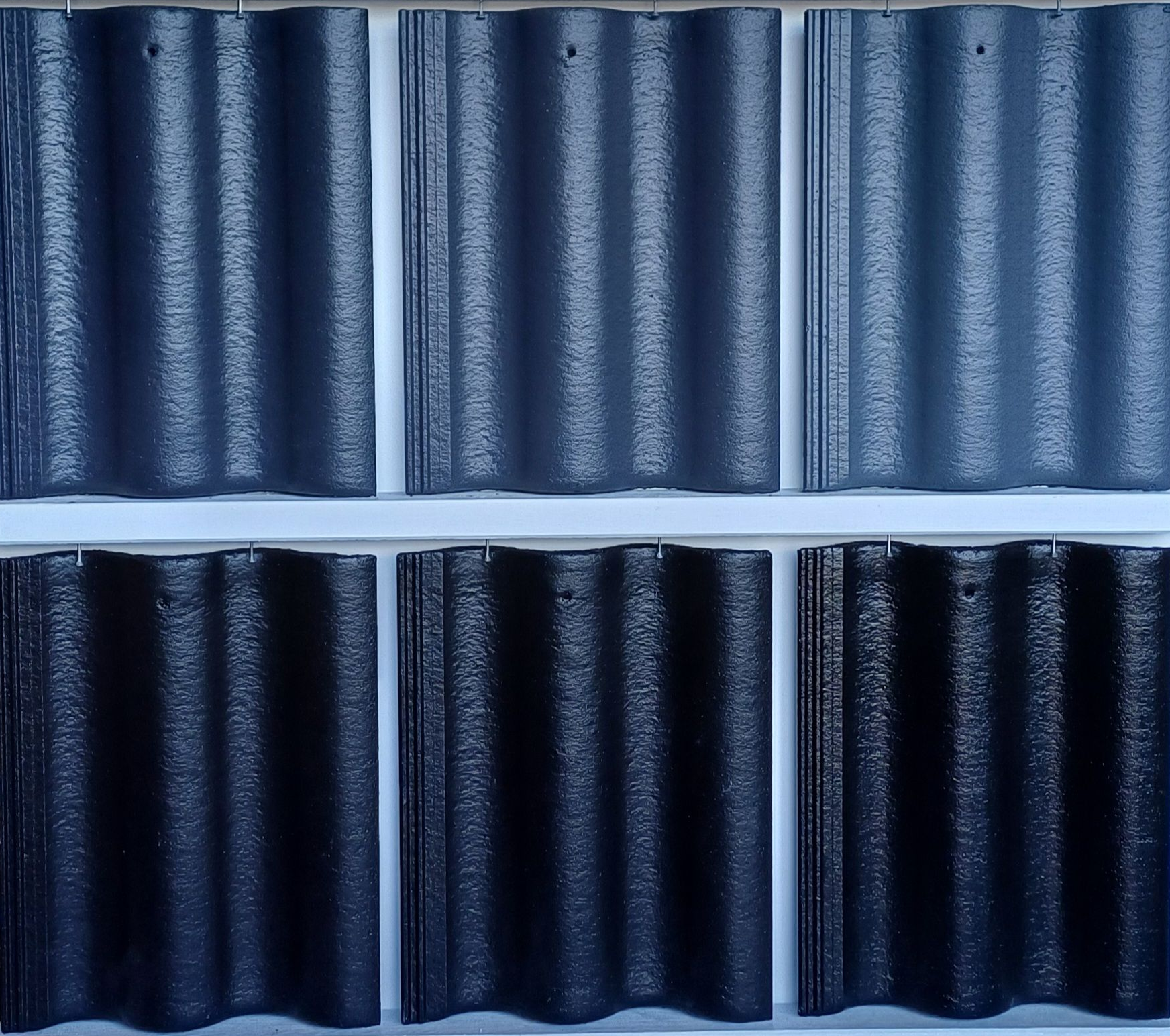 Mossy tiled roof with windows above.