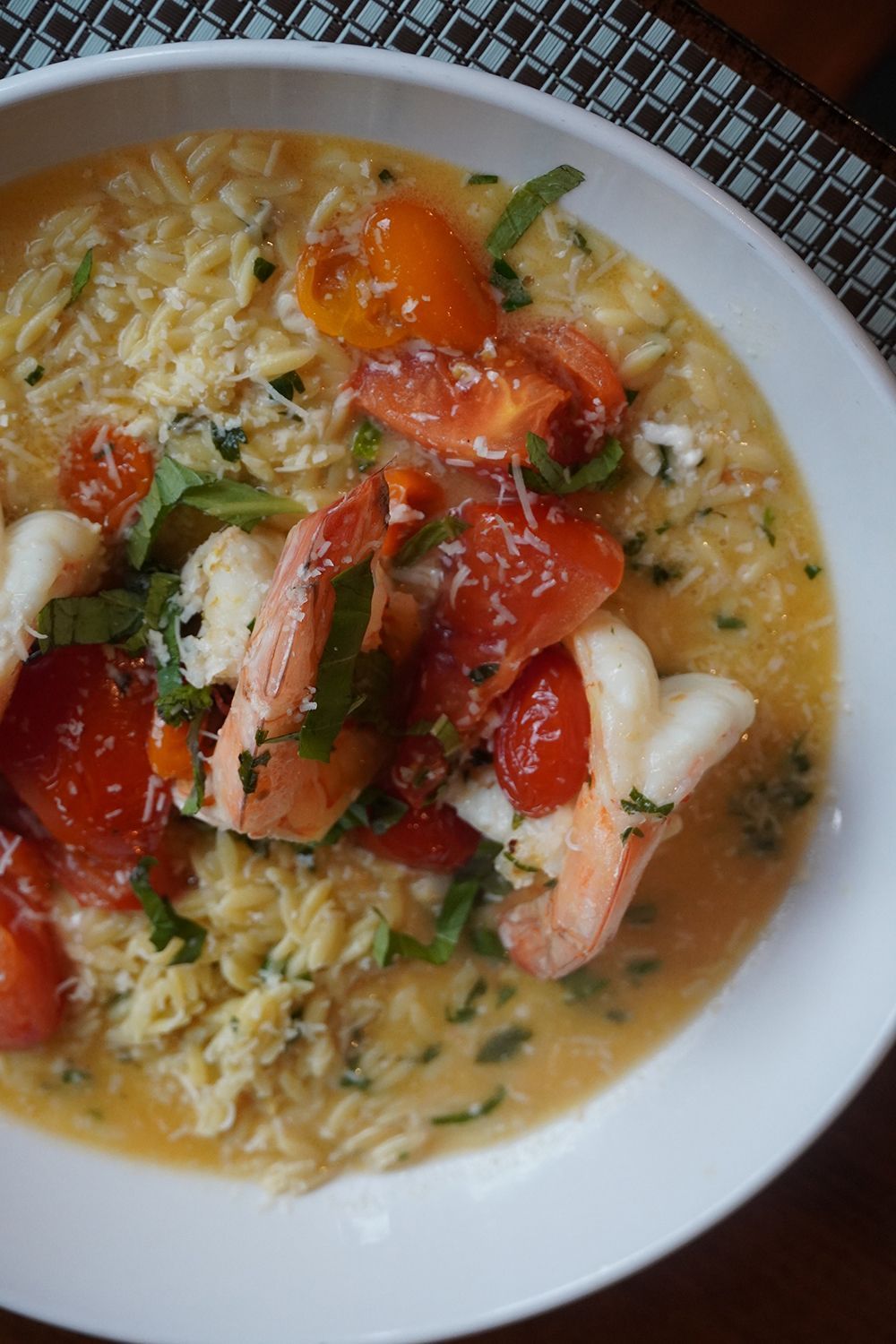 A white bowl containing creamy orzo pasta