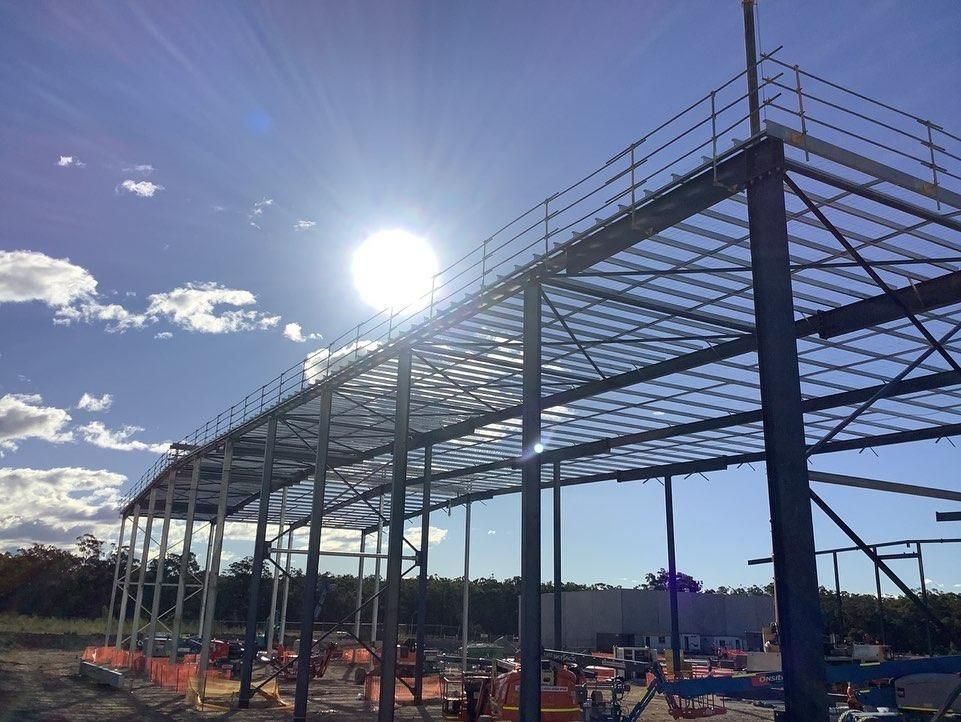 The Sun Is Shining Through the Roof of A Building Under Construction — Site Safety NSW in Port Stephens, NSW