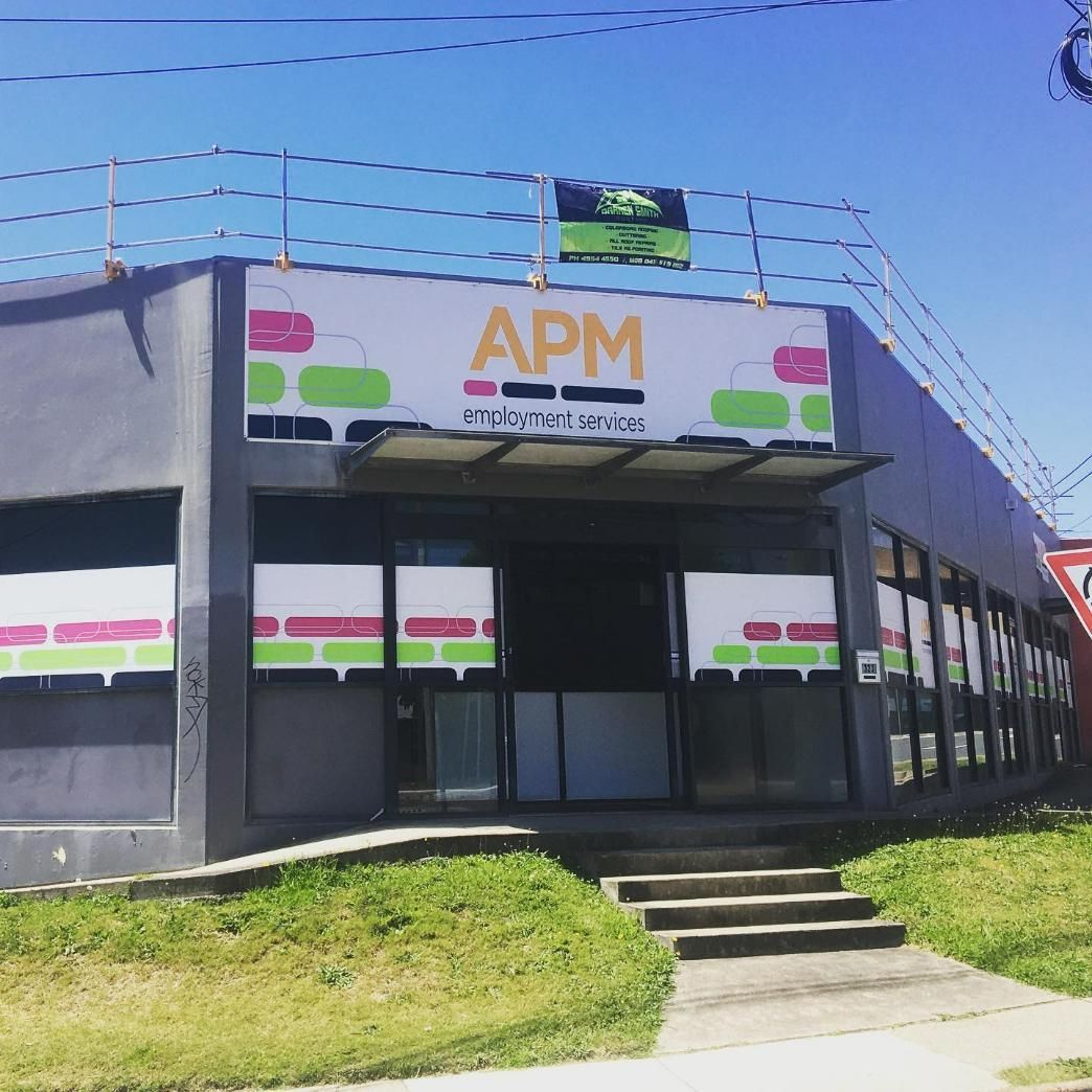 A Building with A Sign that Says APM on It — Site Safety NSW in Mid North Coast, NSW
