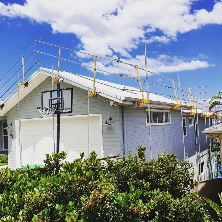A House with A Basketball Hoop on The Side of It — Site Safety NSW in Maitland, NSW