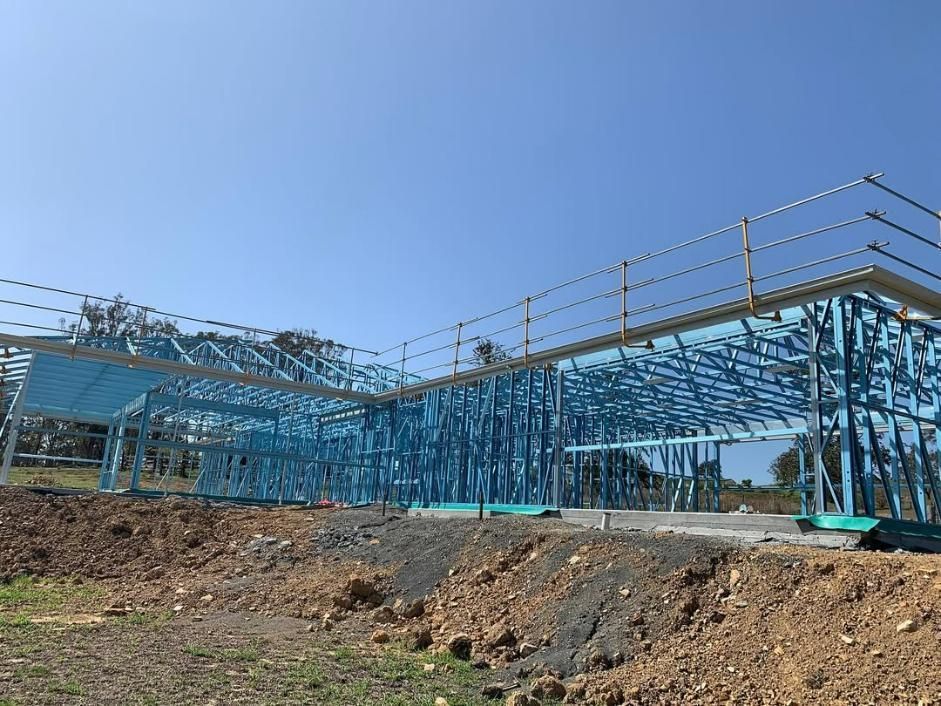 A Large Metal Structure Is Being Built on Top of A Dirt Hill — Site Safety NSW in Port Macquarie, NSW