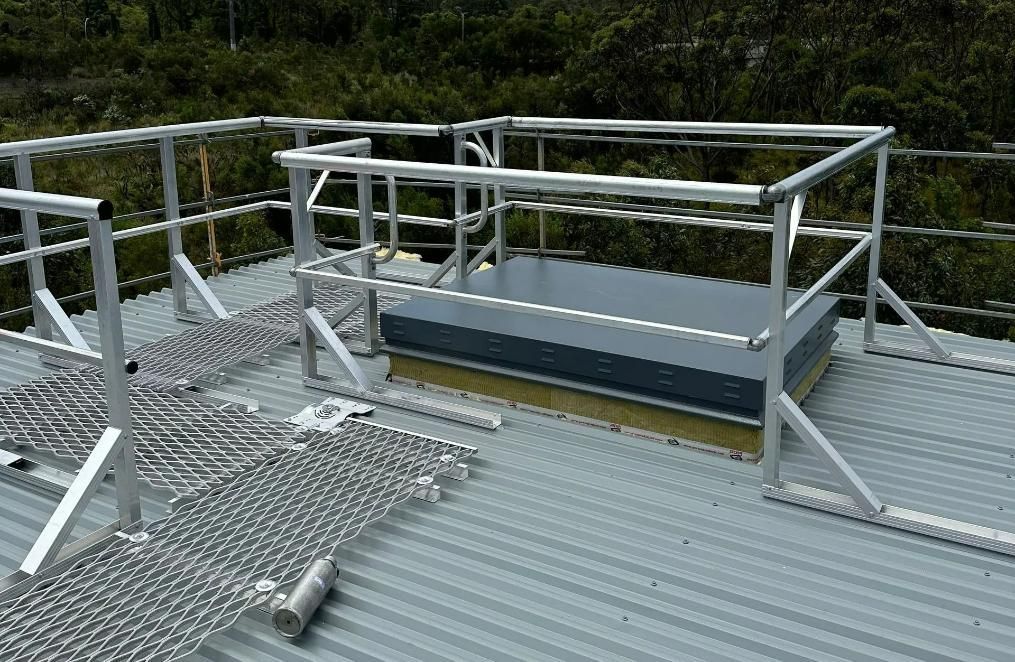 A Roof with A Metal Railing and A Skylight on It  — Site Safety NSW in Port Stephens, NSW