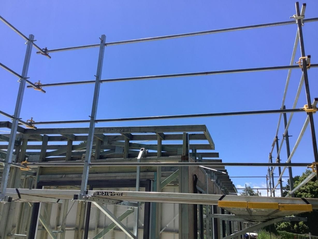 A Building Under Construction with Scaffolding and A Blue Sky in The Background — Site Safety NSW in Sandgate, NSW