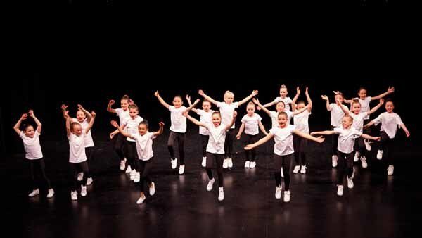 group of kids in white shirts