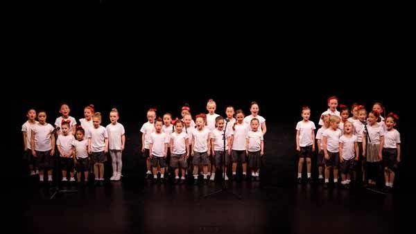 group of dancers in white