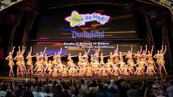 large group in gold dancing