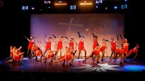 dancers in red dress costumes