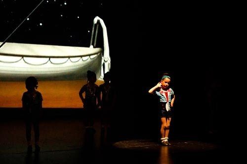 young dancer on stage doing pose