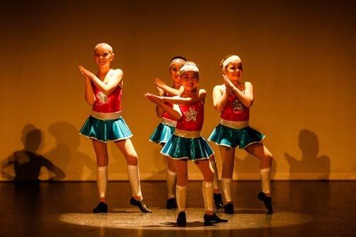 dancers in red and blue costume