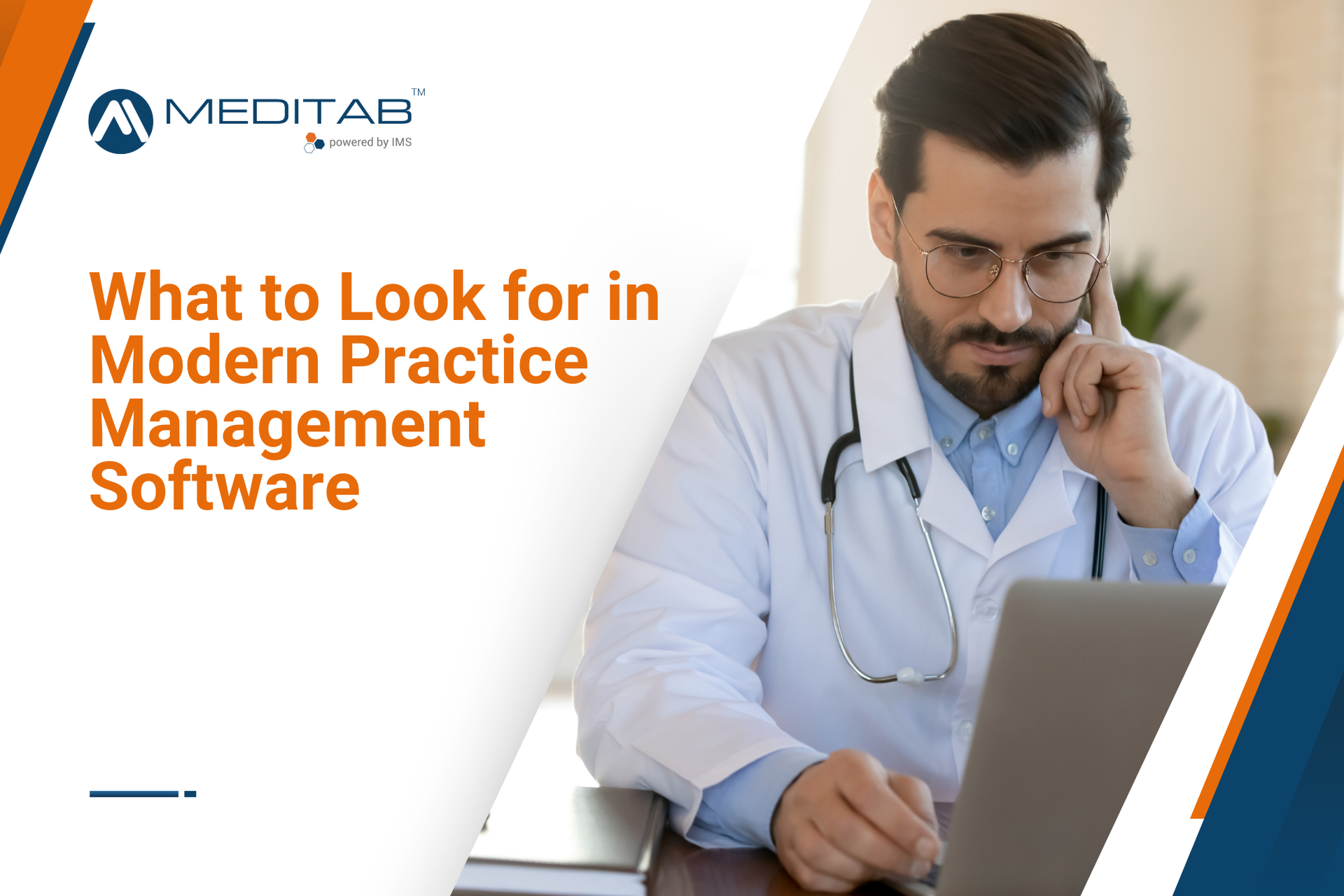 A doctor is sitting at a desk using a laptop computer.