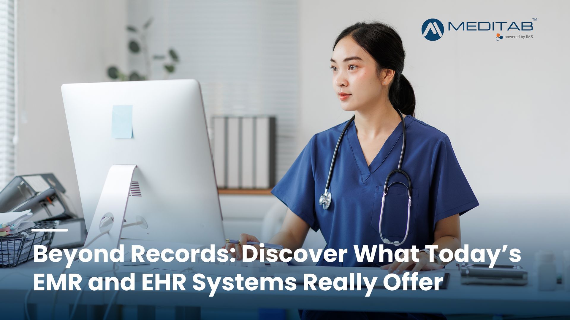 Hospital computer screen displaying patient data in focus, with healthcare professionals discussing in the blurred background.