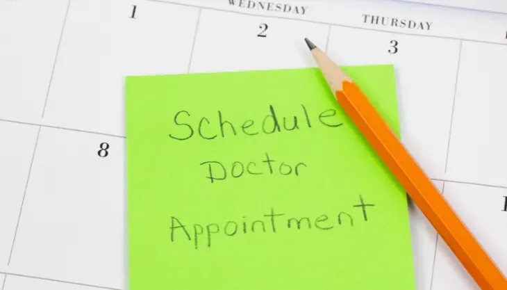 A calendar with a note on it that says schedule doctor appointment