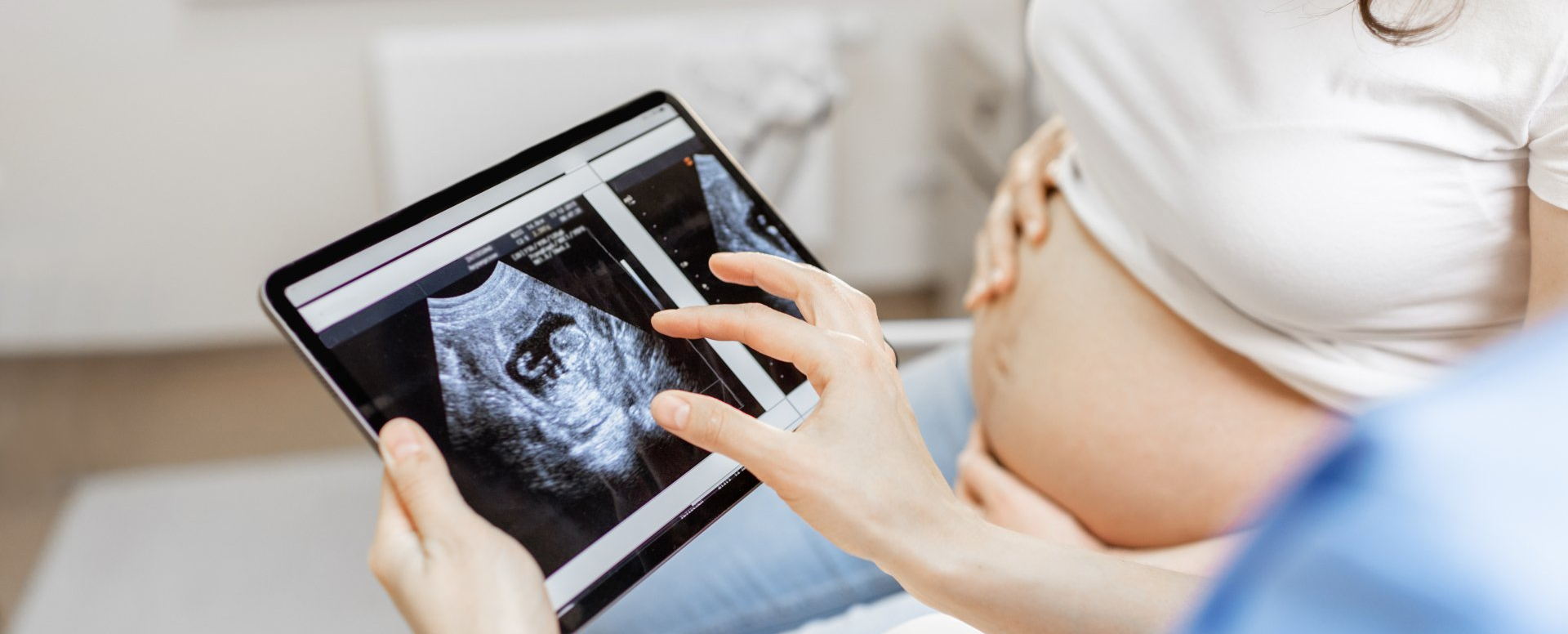 older Lady in pain sitting on coach