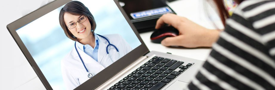A patient having a televisit on her laptop at home and talking to her doctor virtually