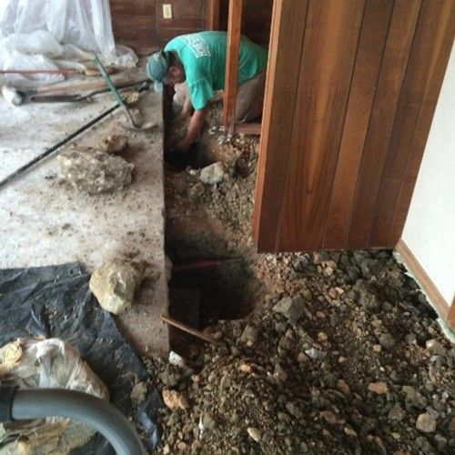 Experienced contractor working on professional concrete foundation repair services.