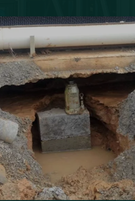 Close-up of slab repair for foundation leveling on a house.