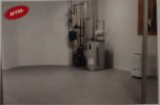 Basement room with concrete floor, white walls, and water heater, marked 