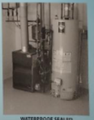 Furnace and water heater in a utility room. Gray metal appliances against a neutral background.