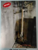 Oil tank before cleaning; stained walls, oil residue, and a vertical pipe.