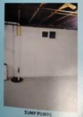Basement interior with sump pump. White walls, dark ceiling, two square vents.