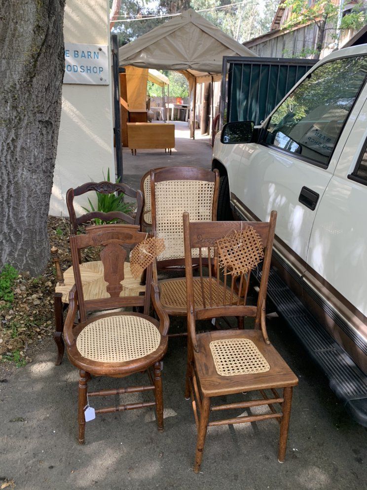 A group of chairs are sitting next to a white truck.