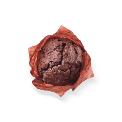 A chocolate muffin wrapped in red wax paper on a white background