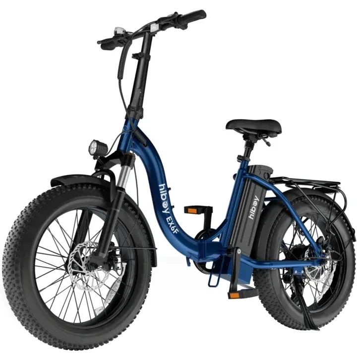 Blue electric bicycle with fat tires, rear rack, and headlight.