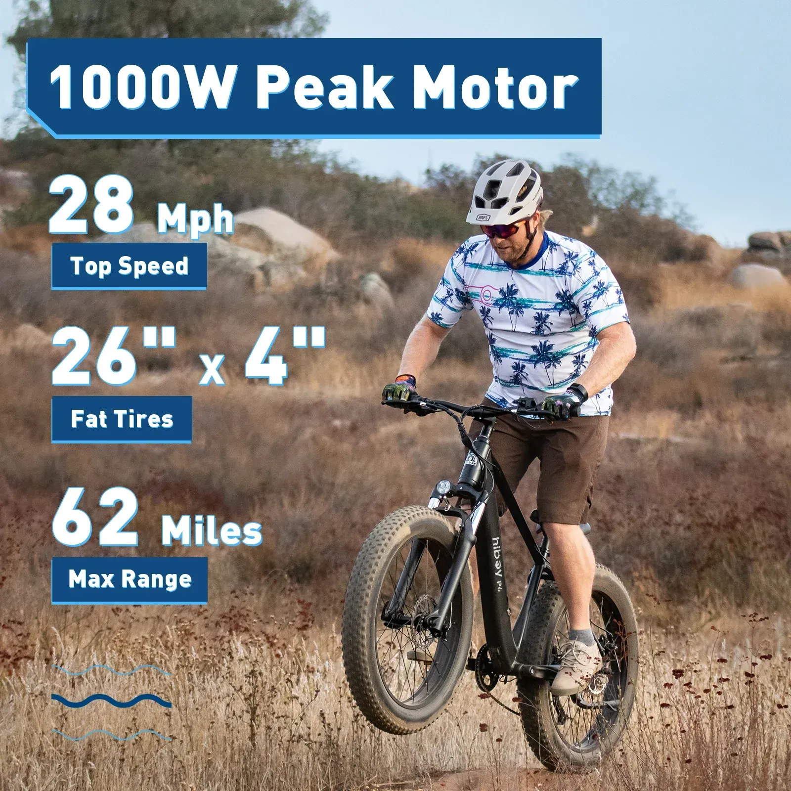 Black electric fat tire bike with thick tires, front headlight, and rear tail light.