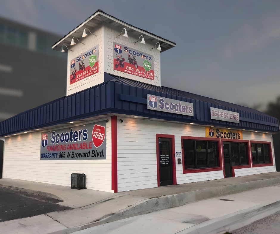 Scooters store building, white with blue trim, signage, and a tower.