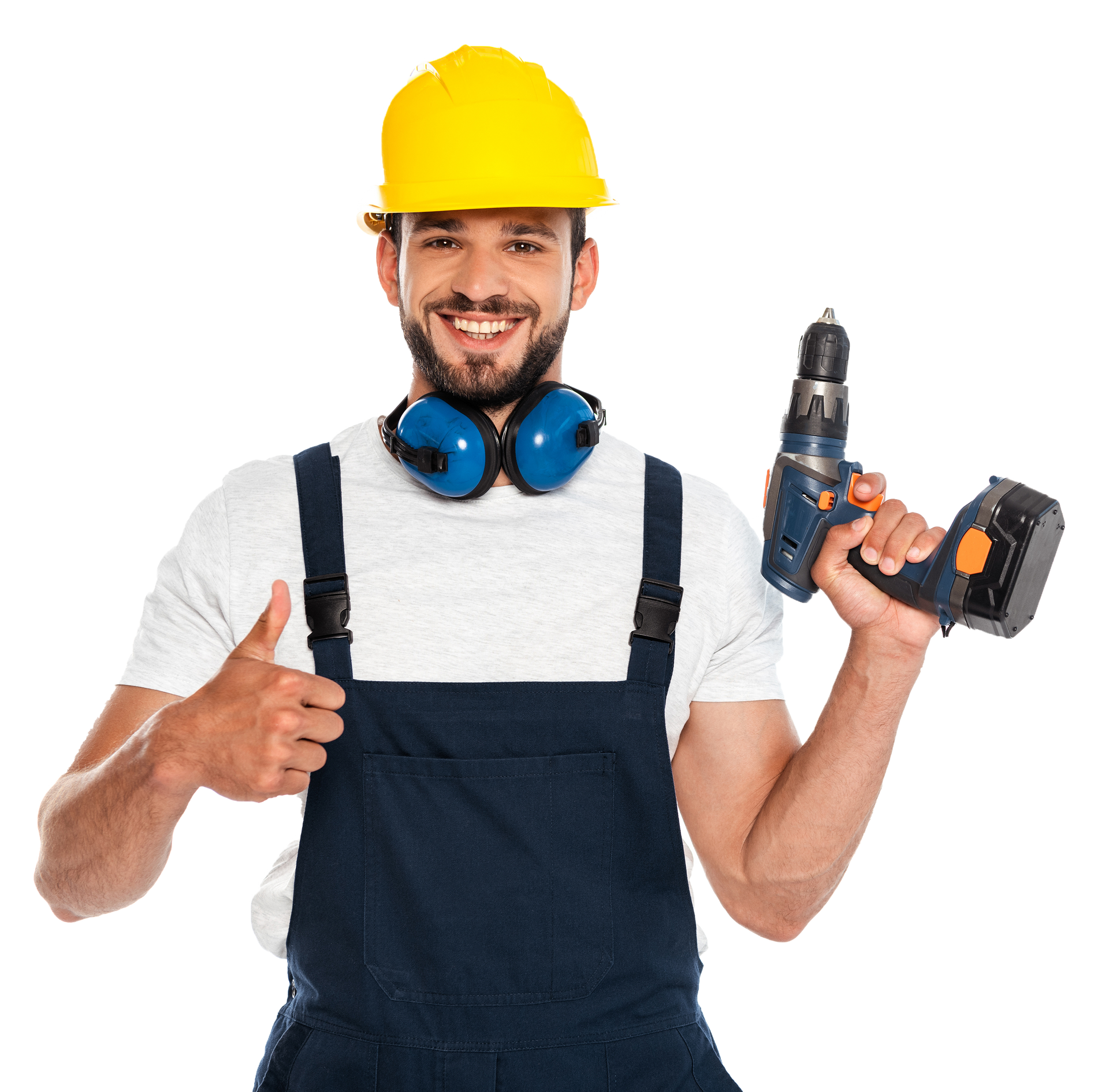 A man wearing a hard hat and overalls is holding a drill and giving a thumbs up.
