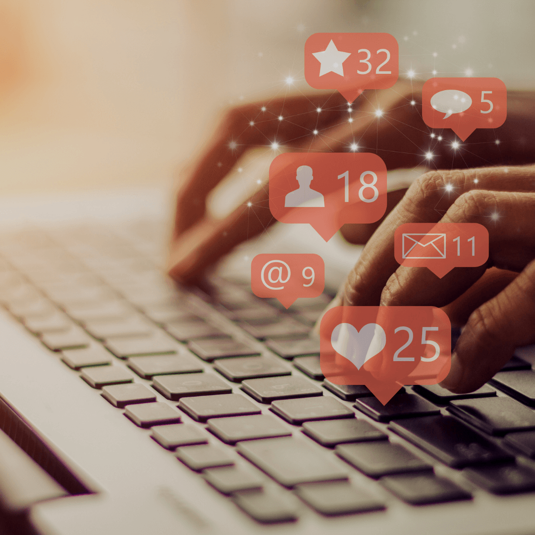 A person is typing on a keyboard with icons coming out of it including one that says 32