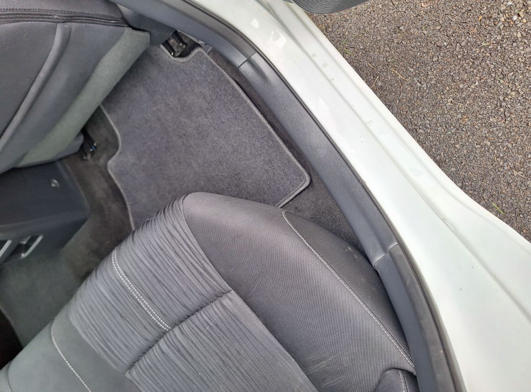 A close up of the back seat of a car.