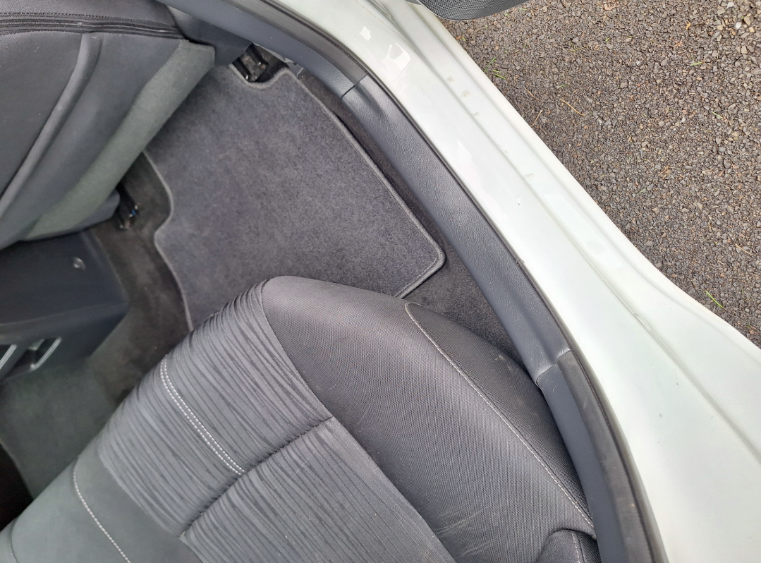 A close up of the back seat of a car.